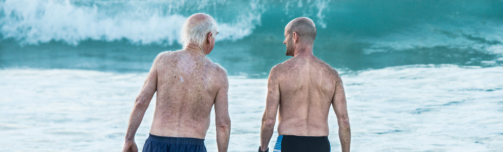 Two men talking at beach