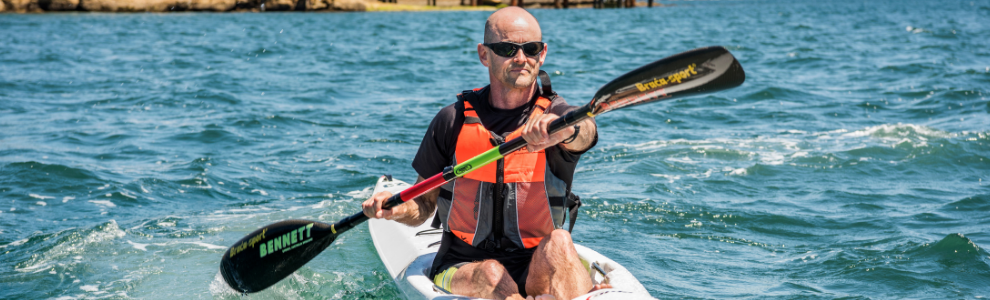 Man rowing at the beach